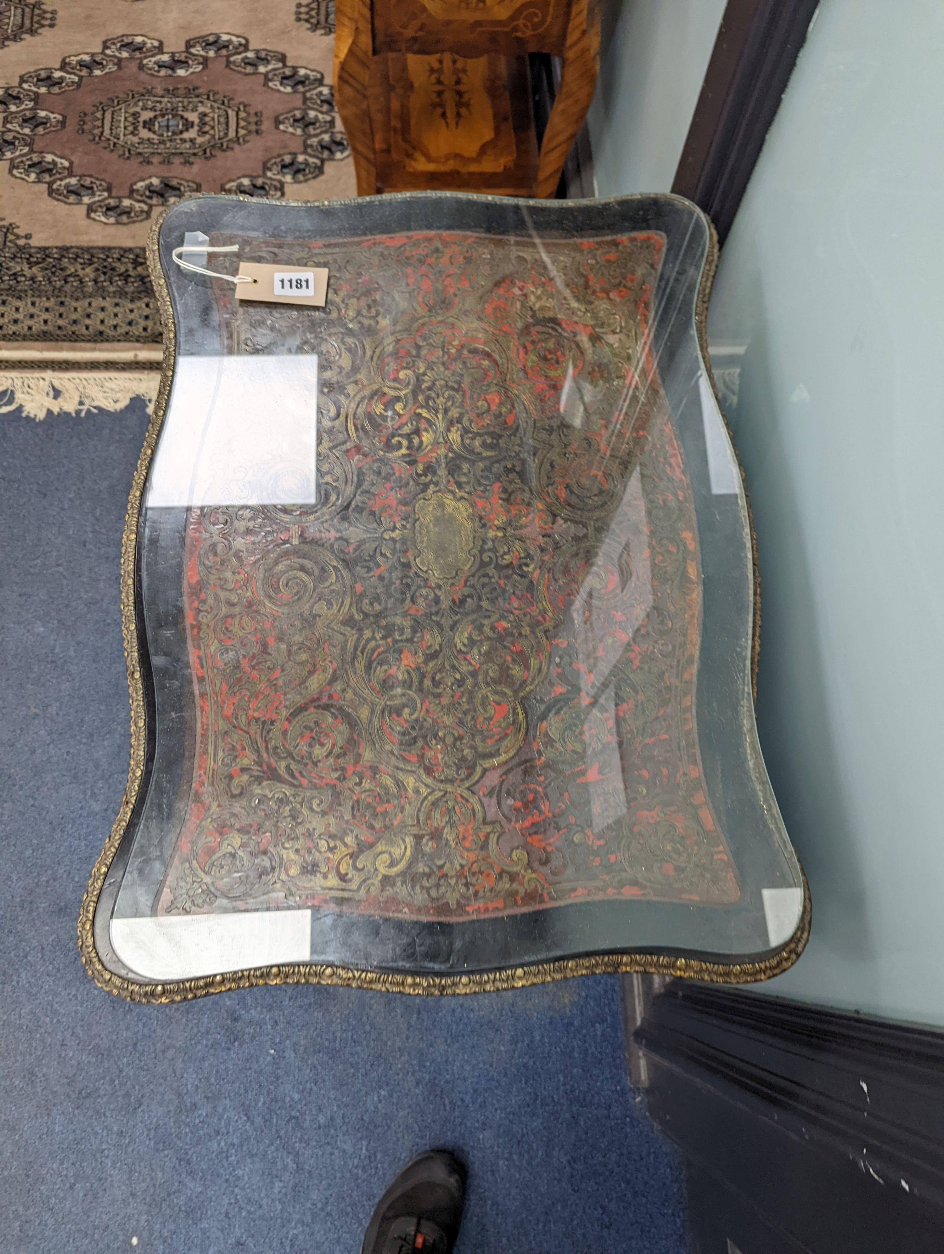 A 19th century French red Boullework poudreuse with mirrored internal lid and fitted interior, width 64cm, height 73cm